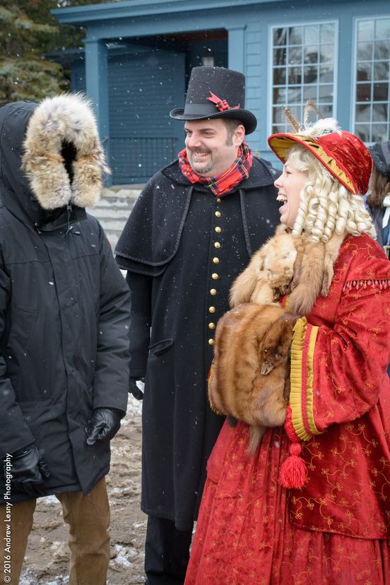 dickens christmas characters interact with patron
