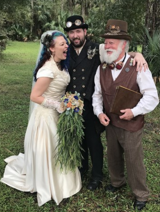 jim with just married couple as their wedding officiant